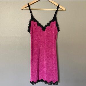 Pink mini slip dress with black lace trim & adjustable straps
Brand: Diva
S